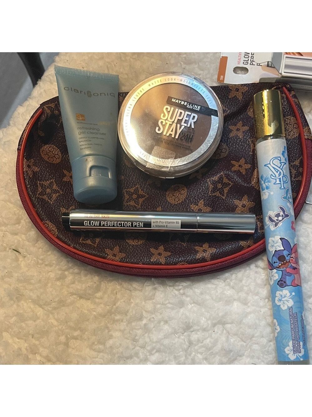 Clarisonic Gel Cleanser and other items with makeup bag